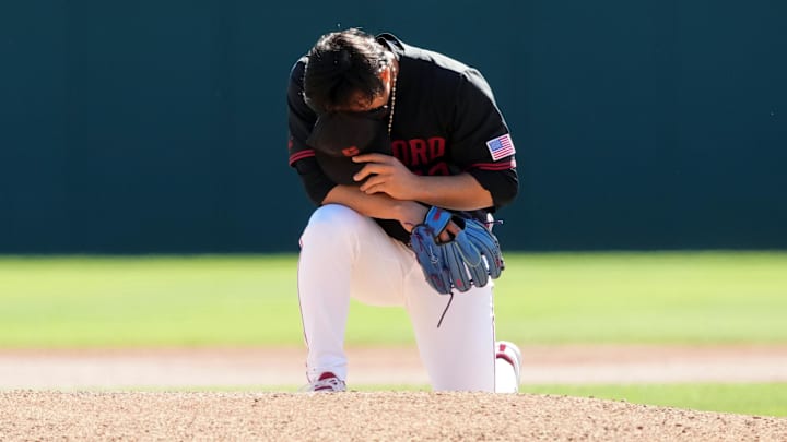 Mar 1, 2025; Stanford, CA, USA; Stanford Cardinal starting pitcher Christian Lim (42) kneels behind the mound before the game against the Xavier Musketeers at Sunken Diamond. Mandatory Credit: Darren Yamashita-Imagn Images