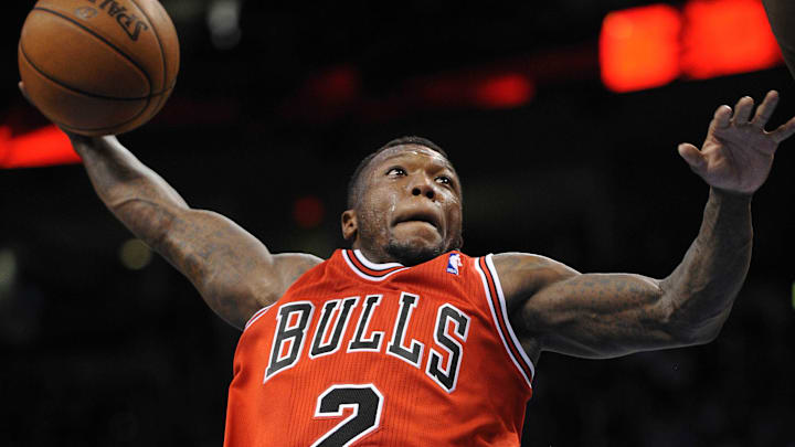 Feb 24, 2013; Oklahoma City, OK, USA; Chicago Bulls guard Nate Robinson (2) attempts a dunk against the Oklahoma City Thunder during the first half at Chesapeake Energy Arena. Mandatory Credit: Mark D. Smith-Imagn Images