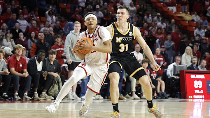 Mar 5, 2025; Norman, Oklahoma, USA; Oklahoma Sooners guard Jeremiah Fears (0) drives to the basket around Missouri Tigers guard Caleb Grill (31) during the second half at Lloyd Noble Center. Mandatory Credit: Alonzo Adams-Imagn Images Mar 5, 2025; Norman, Oklahoma, USA; Oklahoma Sooners guard Jeremiah Fears (0) drives to the basket around Missouri Tigers guard Caleb Grill (31) during the second half at Lloyd Noble Center. Mandatory Credit: Alonzo Adams-Imagn Images