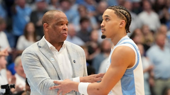 Mar 8, 2025; Chapel Hill, North Carolina, USA;  North Carolina Tar Heels head coach Hubert Davis with guard Seth Trimble (7) in the second half at Dean E. Smith Center. Mandatory Credit: Bob Donnan-Imagn Images