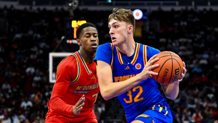 Apr 2, 2024; Houston, TX, USA; McDonald's All American East forward Cooper Flagg (32) controls the ball as McDonald's All American West guard Valdez Edgecombe Jr (7) defends during the first half at Toyota Center. Mandatory Credit: Maria Lysaker-USA TODAY Sports