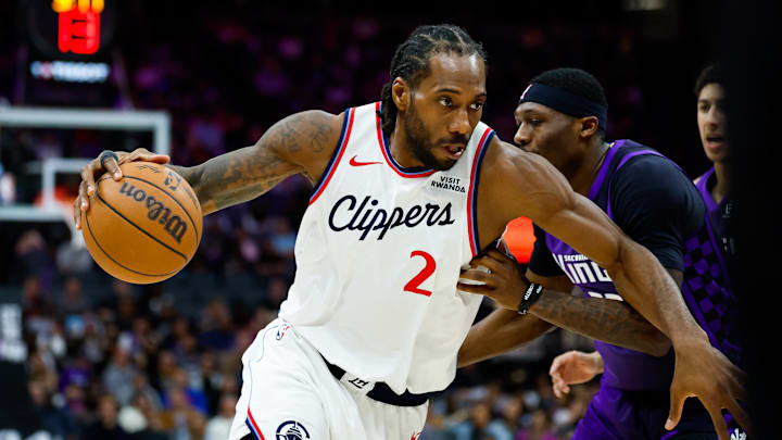 Feb 6, 2026; Sacramento, California, USA; Los Angeles Clippers forward Kawhi Leonard (2) dribbles past Sacramento Kings guard Daeqwon Plowden (29) during the fourth quarter at Golden 1 Center. Mandatory Credit: Sergio Estrada-Imagn Images