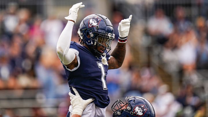 Connecticut Huskies wide receiver Skyler Bell (1) celebrates after his touchdown.