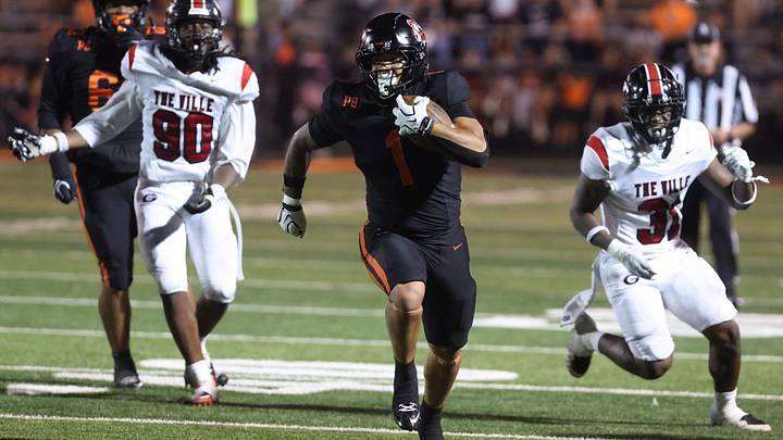 Massillon’s Savior Owens runs for a second-half touchdown against Glenville at Paul Brown Tiger Stadium. Friday, Aug. 21, 2026. Massillon’s Savior Owens runs for a second-half touchdown against Glenville at Paul Brown Tiger Stadium. Friday, Aug. 21, 2026.