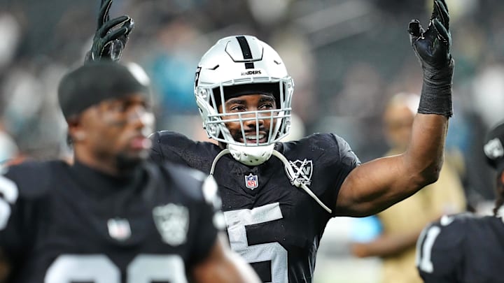 Dec 22, 2024; Paradise, Nevada, USA; Las Vegas Raiders linebacker Divine Deablo (5) celebrates after the Raiders defeated the Jacksonville Jaguars 19-14 at Allegiant Stadium. Mandatory Credit: Stephen R. Sylvanie-Imagn Images