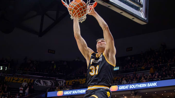 Jan. 18 2025; Columbia, Missouri, USA; Missouri Tigers guard Caleb Grill (31) slams down a dunk for Missouri's final points in an 83-65 victory over the Arkansas Razorbacks at Mizzou Arena.