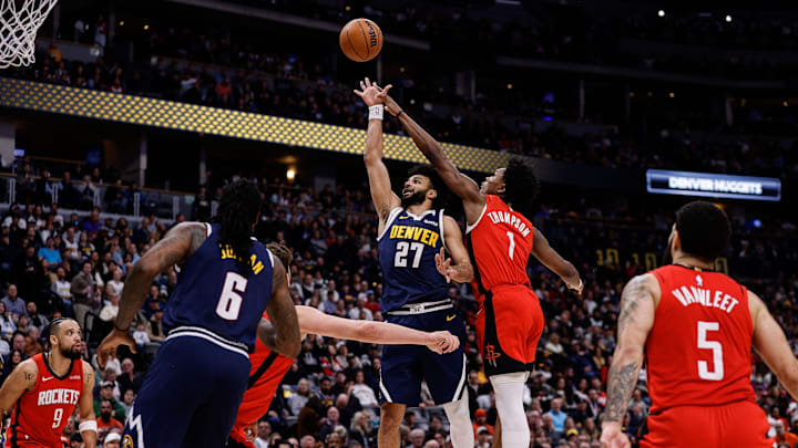 Jan 15, 2025; Denver, Colorado, USA; Denver Nuggets guard Jamal Murray (27) attempts a shot under pressure from Houston Rockets forward Amen Thompson (1) as center DeAndre Jordan (6) and guard Fred VanVleet (5) defend in the third quarter at Ball Arena. Mandatory Credit: Isaiah J. Downing-Imagn Images