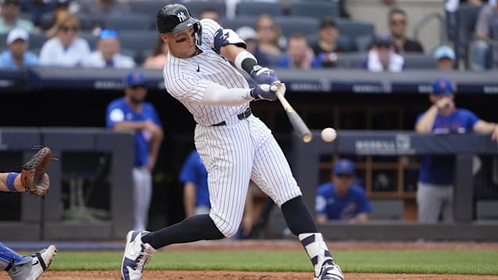 New York Yankees right fielder Aaron Judge (99) hits a double during the fourth inning at Yankee Stadium. 