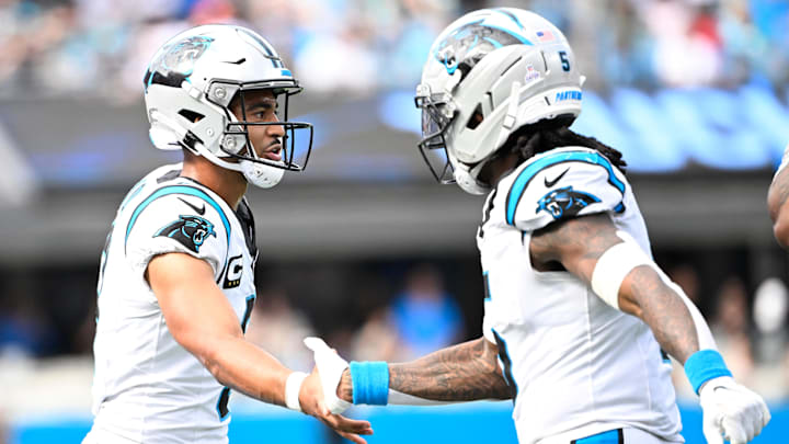 Carolina Panthers running back Rico Dowdle and quarterback Bryce Young.