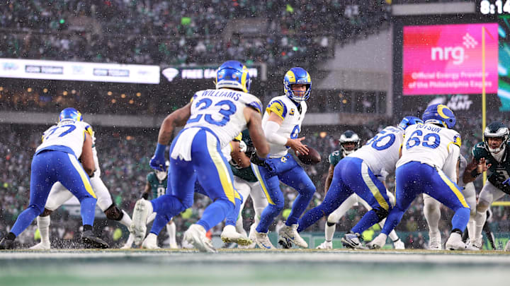Jan 19, 2025; Philadelphia, Pennsylvania, USA; Los Angeles Rams quarterback Matthew Stafford (9) prepares to hand the ball to Los Angeles Rams running back Kyren Williams (23) against the Philadelphia Eagles during the first half in a 2025 NFC divisional round game at Lincoln Financial Field. Mandatory Credit: Bill Streicher-Imagn Images Jan 19, 2025; Philadelphia, Pennsylvania, USA; Los Angeles Rams quarterback Matthew Stafford (9) prepares to hand the ball to Los Angeles Rams running back Kyren Williams (23) against the Philadelphia Eagles during the first half in a 2025 NFC divisional round game at Lincoln Financial Field. Mandatory Credit: Bill Streicher-Imagn Images