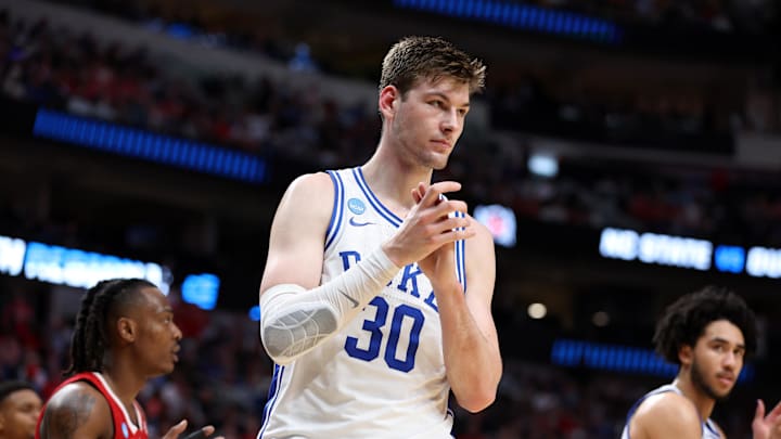 Mar 31, 2024; Dallas, TX, USA; Duke Blue Devils center Kyle Filipowski (30) reacts in the first half against the North Carolina State Wolfpack in the finals of the South Regional of the 2024 NCAA Tournament at American Airline Center. Mandatory Credit: Tim Heitman-Imagn Images Mar 31, 2024; Dallas, TX, USA; Duke Blue Devils center Kyle Filipowski (30) reacts in the first half against the North Carolina State Wolfpack in the finals of the South Regional of the 2024 NCAA Tournament at American Airline Center. Mandatory Credit: Tim Heitman-Imagn Images