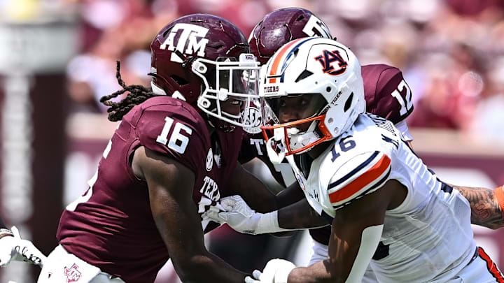 Sep 23, 2023; College Station, Texas, USA; Auburn Tigers wide receiver Malcolm Johnson Jr. (16) and Texas A&M Aggies quarterback Jaylen Henderson (16) in action on punt return during the third quarter at Kyle Field. Mandatory Credit: Maria Lysaker-Imagn Images