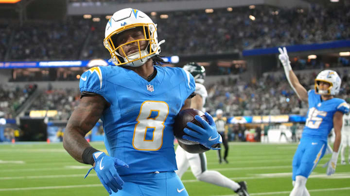 Los Angeles Chargers running back Omarion Hampton (8) runs for a touchdown against the Philadelphia Eagles in the first half at SoFi Stadium. 