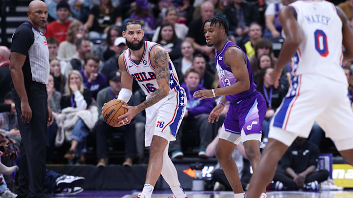 Dec 28, 2024; Salt Lake City, Utah, USA; Philadelphia 76ers forward Caleb Martin (16) looks to pass against Utah Jazz guard Isaiah Collier (13) during the fourth quarter at Delta Center. Mandatory Credit: Rob Gray-Imagn Images