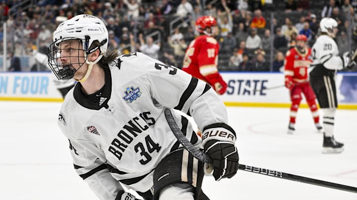 Apr 10, 2025; St. Louis, Mo. | Western Michigan Broncos forward Owen Michaels (34) reacts after scoring against the Denver Pioneers during the second period of the Frozen Four college ice hockey national semifinals at Enterprise Center. 