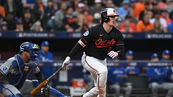 Oct 2, 2024; Baltimore, Maryland, USA; Baltimore Orioles catcher Adley Rutschman (35) hits a single against the Kansas City Royals in the fourth inning in game two of the Wild Card round for the 2024 MLB Playoffs at Oriole Park at Camden Yards.