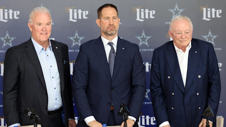 Dallas Cowboys CEO Stephen Jones, head coach Brian Schottenheimer and owner Jerry Jones pose for pictures after a press conference at the Star.  