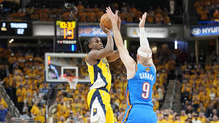 Jun 13, 2025; Indianapolis, Indiana, USA; Indiana Pacers guard Bennedict Mathurin (00) shoots the ball against Oklahoma City Thunder guard Alex Caruso (9) during the second half during game four of the 2025 NBA Finals at Gainbridge Fieldhouse. Mandatory Credit: Kyle Terada-Imagn Images
