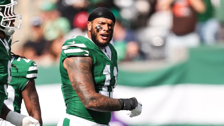 New York Jets linebacker Jermaine Johnson celebrates a defensive stop in the first quarter against the Carolina Panthers