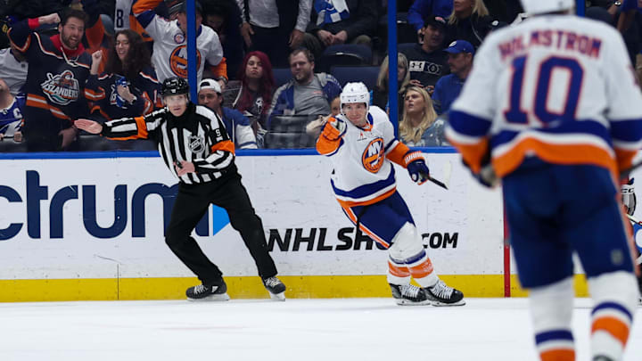 Feb 1, 2025; Tampa, Florida, USA; New York Islanders defenseman Tony DeAngelo (4) celebrates after scoring a goal against the Tampa Bay Lightning in overtime at Amalie Arena. Mandatory Credit: Nathan Ray Seebeck-Imagn Images