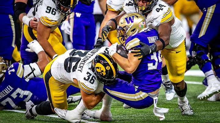 Brian Bonner Jr. goes down on a night the UW rushed for -3 yards against Iowa. Brian Bonner Jr. goes down on a night the UW rushed for -3 yards against Iowa.