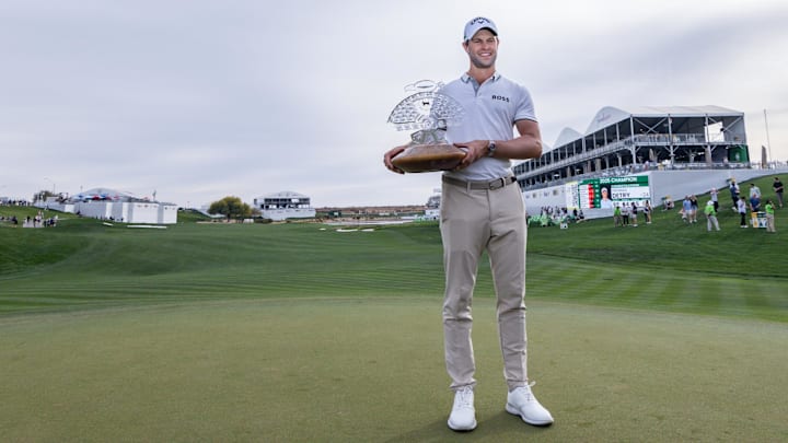 Feb 9, 2025; Scottsdale, Arizona, USA; Thomas Detry of Belgium holds up his trophy at the 18th hole during the final round of the WM Phoenix Open golf tournament. Mandatory Credit: Aryanna Frank-Imagn Images