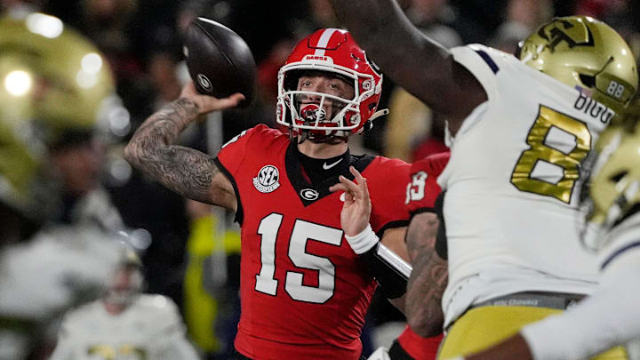 Georgia quarterback Carson Beck (15) throws the ball during the first half of a NCAA college football game against Georgia Tech in Athens, Ga., on Friday, Nov. 29, 2024.