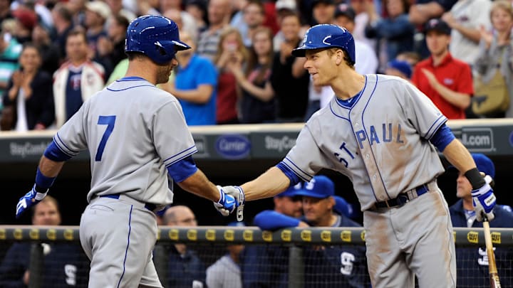 Justin Morneau and Joe Mauer wearing old school St. Paul Jerseys
