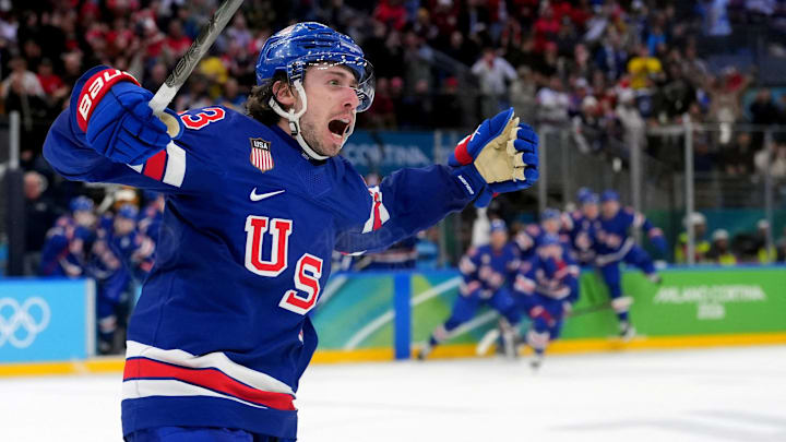 Feb 18, 2026; Milan, Italy; Quinn Hughes (43) of the United States celebrates his winning goal in overtime against Sweden in a men's ice hockey quarterfinal during the Milano Cortina 2026 Olympic Winter Games at Milano Santagiulia Ice Hockey Arena. Mandatory Credit: Amber Searls-Imagn Images