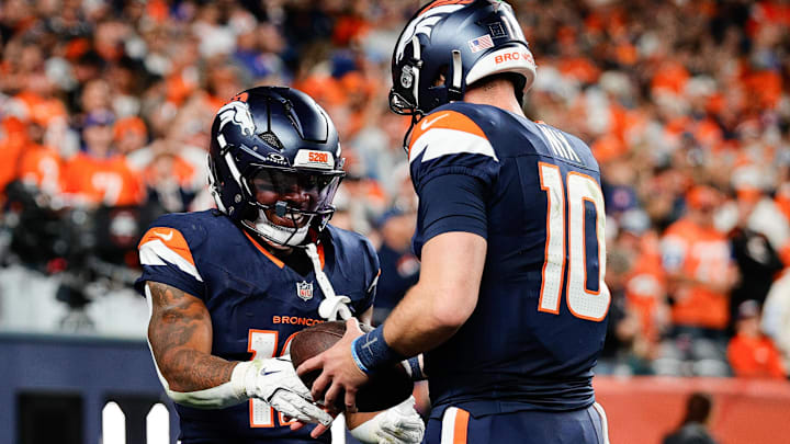 Sep 29, 2025; Denver, Colorado, USA; Denver Broncos running back RJ Harvey (12) celebrates with Denver Broncos quarterback Bo Nix (10) after scoring a touchdown during the fourth quarter against the Cincinnati Bengals at Empower Field at Mile High. Mandatory Credit: Isaiah J. Downing-Imagn Images Sep 29, 2025; Denver, Colorado, USA; Denver Broncos running back RJ Harvey (12) celebrates with Denver Broncos quarterback Bo Nix (10) after scoring a touchdown during the fourth quarter against the Cincinnati Bengals at Empower Field at Mile High. Mandatory Credit: Isaiah J. Downing-Imagn Images