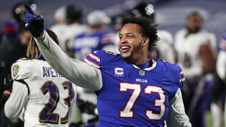 Buffalo Bills Dion Dawkins celebrates with fans after Buffalo beat the Ravens 