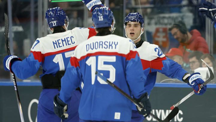 Feb 11, 2026; Milan, Italy; Juraj Slafkovsky of Slovakia celebrates scoring their third goal with Simon Nemec of Slovakia and Dalibor Dvorsky of Slovakia against Finland in men's ice hockey group B play during the Milano Cortina 2026 Olympic Winter Games at Milano Santagiulia Ice Hockey Arena. Mandatory Credit: Geoff Burke-Imagn Images Feb 11, 2026; Milan, Italy; Juraj Slafkovsky of Slovakia celebrates scoring their third goal with Simon Nemec of Slovakia and Dalibor Dvorsky of Slovakia against Finland in men's ice hockey group B play during the Milano Cortina 2026 Olympic Winter Games at Milano Santagiulia Ice Hockey Arena. Mandatory Credit: Geoff Burke-Imagn Images