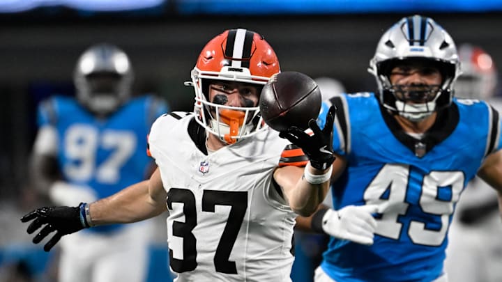 Aug 8, 2025; Charlotte, North Carolina, USA; Cleveland Browns wide receiver Luke Floriea (37) with a fingertip catch as Carolina Panthers linebacker Jon Rhattigan (49) defends in the second quarter at Bank of America Stadium. Mandatory Credit: Bob Donnan-Imagn Images