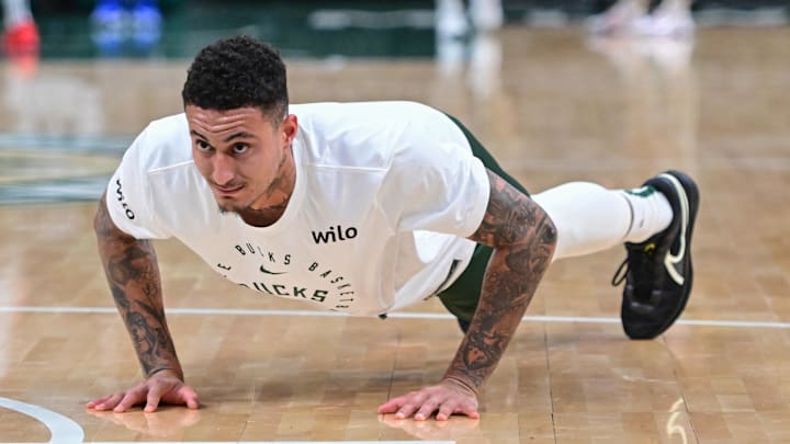 Apr 10, 2025; Milwaukee, Wisconsin, USA; Milwaukee Bucks forward Kyle Kuzma (18) does pushups before game against the New Orleans Pelicans at Fiserv Forum. Mandatory Credit: Benny Sieu-Imagn Images