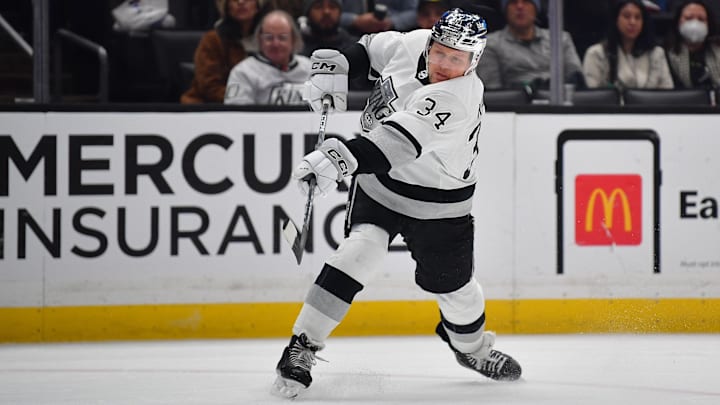 Feb 24, 2024; Los Angeles, California, USA; Los Angeles Kings right wing Arthur Kaliyev (34) shoots on goal against the Anaheim Ducks during the second period at Crypto.com Arena. Mandatory Credit: Gary A. Vasquez-Imagn Images