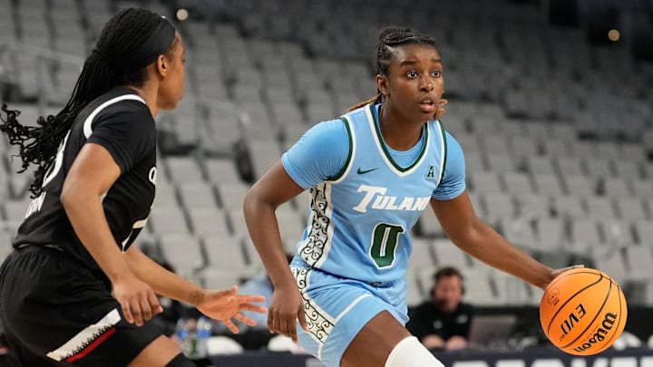 Mar 6, 2023; Fort Worth, TX, USA; Tulane Green Wave guard Kyren Whittington (0) controls the ball against Cincinnati Bearcats guard Mya Jackson (23) during the first half at Dickies Arena.