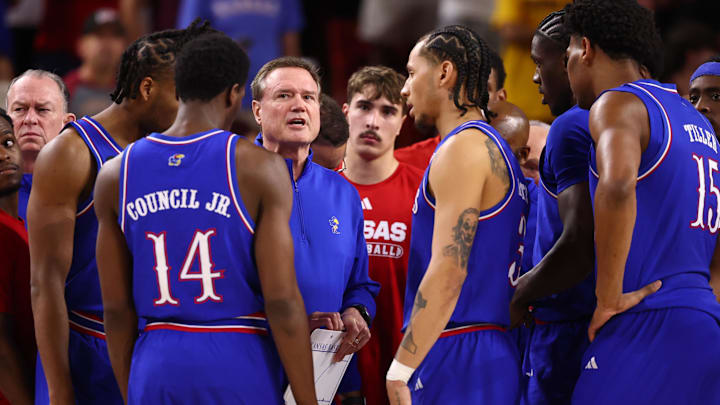 Mar 3, 2026; Tempe, Arizona, USA; Kansas Jayhawks head coach Bill Self (center) in the huddle with his players against the Arizona State Sun Devils in the first half at Desert Financial Arena. Mandatory Credit: Mark J. Rebilas-Imagn Images