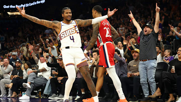 Nov 6, 2025; Phoenix, Arizona, USA; Phoenix Suns guard Jalen Green (4) celebrates a three point shot against the Los Angeles Clippers in the second half at the Mortgage Matchup Center. Mandatory Credit: Mark J. Rebilas-Imagn Images