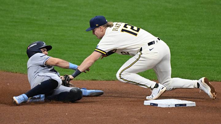 Oct 23, 2026; Milwaukee, Wisconsin, USA;  Milwaukee Brewers shortstop Cooper Pratt (12) tags out Tampa Bay Rays first baseman Jonathan Aranda (8) during the sixth inning in game one of the 2026 World Series at American Family Field.  Mandatory Credit: Matt Marton-Imagn Images