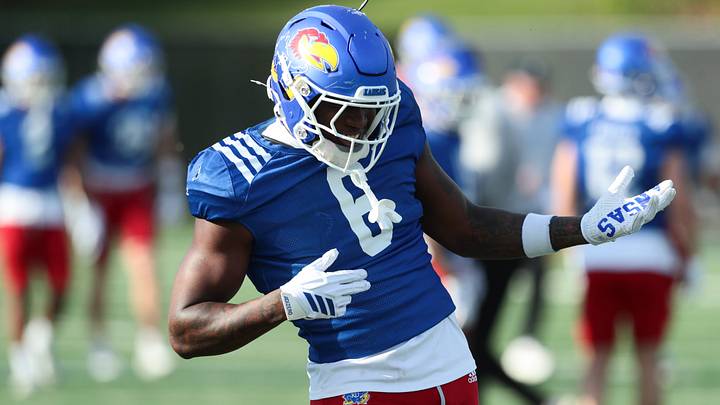 Kansas redshirt junior running back Yasin Willis (6) jams to the music during practice at the University of Kansas on Thursday, April 9, 2026.