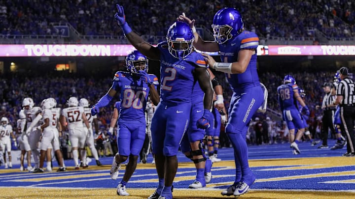 Boise State running back Ashton Jeanty (2) and quarterback Maddux Madsen (4) celebrate against Washington State. Boise State running back Ashton Jeanty (2) and quarterback Maddux Madsen (4) celebrate against Washington State.
