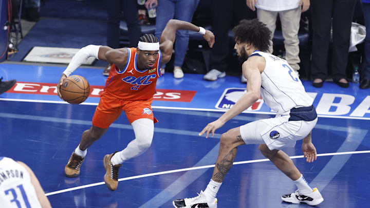 Dec 10, 2024; Oklahoma City, Oklahoma, USA; Oklahoma City Thunder guard Shai Gilgeous-Alexander (2) drives to the basket against Dallas Mavericks center Dereck Lively II (2) during the first quarter at Paycom Center. Mandatory Credit: Alonzo Adams-Imagn Images Dec 10, 2024; Oklahoma City, Oklahoma, USA; Oklahoma City Thunder guard Shai Gilgeous-Alexander (2) drives to the basket against Dallas Mavericks center Dereck Lively II (2) during the first quarter at Paycom Center. Mandatory Credit: Alonzo Adams-Imagn Images