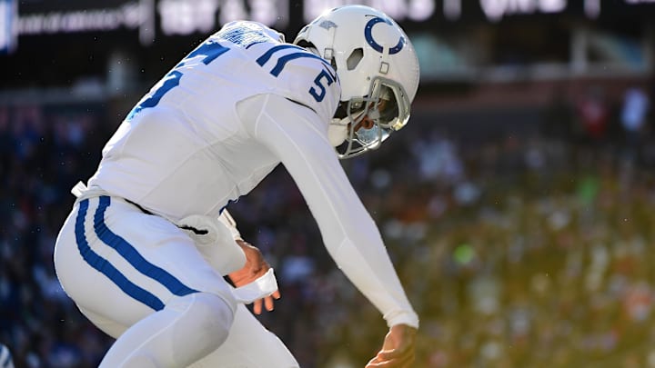 Dec 1, 2024; Foxborough, Massachusetts, USA;  Indianapolis Colts quarterback Anthony Richardson (5) spikes the ball after scoring a touchdown during the first half against the New England Patriots at Gillette Stadium. Mandatory Credit: Bob DeChiara-Imagn Images