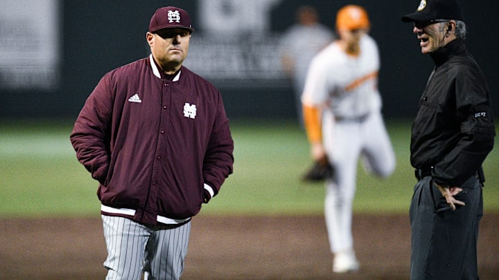 Mississippi State baseball coach Chris Lemonis talks with an official during the NCAA baseball game