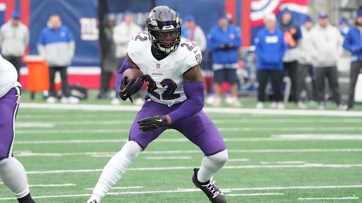 Dec 15, 2024; East Rutherford, New Jersey, USA; Baltimore Ravens running back Derrick Henry (22) runs against the New York Giants during the first half at MetLife Stadium. Mandatory Credit: Robert Deutsch-Imagn Images