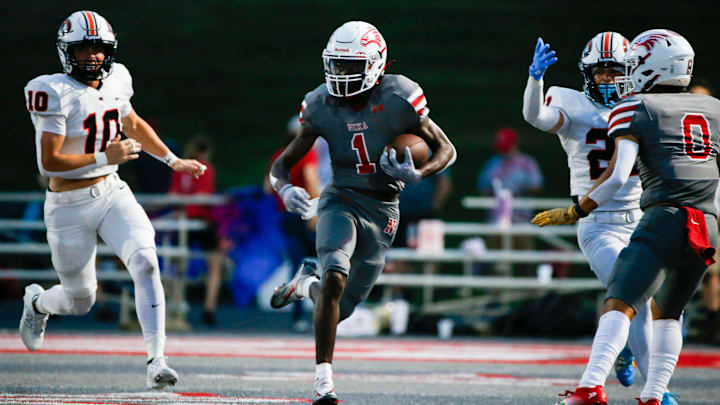 Nixa's Kevion Flint carries the ball as the Eagles took on the Republic Tigers at Nixa on Friday, Aug. 30, 2024.