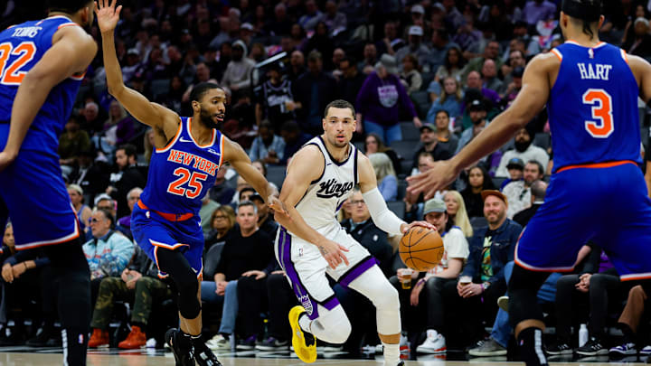 Mar 10, 2025; Sacramento, California, USA; Sacramento Kings guard Zach LaVine (8) dribbles the ball against New York Knicks forward Mikal Bridges (25) during the third quarter at Golden 1 Center. Mandatory Credit: Sergio Estrada-Imagn Images