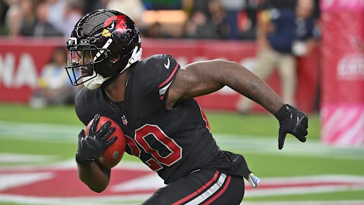 Oct 5, 2025; Glendale, Arizona, USA; Arizona Cardinals running back Bam Knight (20) returns a kickoff against the Tennessee Titans during the fourth quarter at State Farm Stadium. Mandatory Credit: Matt Kartozian-Imagn Images