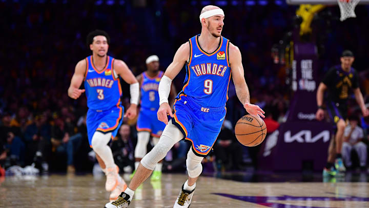May 11, 2026; Los Angeles, California, USA; Oklahoma City Thunder guard Alex Caruso (9) moves the ball down  court against the Los Angeles Lakers during the second half in game four of the second round of the 2026 NBA Playoffs at Crypto.com Arena.