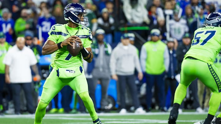 Dec 15, 2024; Seattle, Washington, USA; Seattle Seahawks quarterback Geno Smith (7) looks to pass against the Green Bay Packers during the first quarter at Lumen Field. Mandatory Credit: Joe Nicholson-Imagn Images